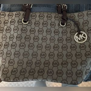 Michael Kors Brown canvas tote with bag charm